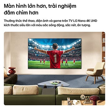 LG NANO 4K UHD AI NU80 Ultra Big TV screen is wall-mounted in a room, displaying a soccer player’s celebration at the center of a stadium under bright arena lights, emphasizing vivid color, clarity, and immersive scale.